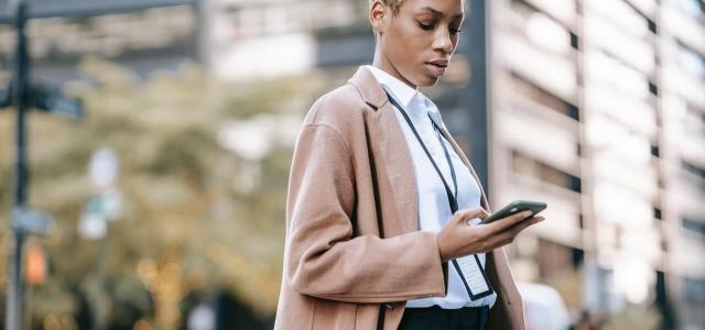 Businesswoman looking at her phone