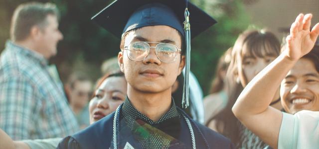 Man in a graduation cap and gown